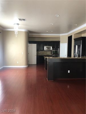 Chandelier, Interior, Kitchen, Recessed Lighting, Stainless Steel Appliances, Wood Texture Flooring
