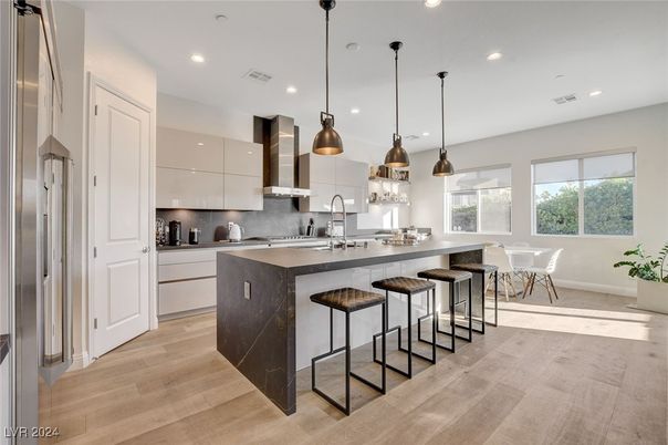Dining room, Interior, Kitchen, Pendant Lights, Recessed Lighting, Stainless Steel Appliances, Wood Texture Flooring