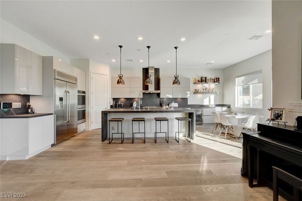 Dining room, Interior, Kitchen, Pendant Lights, Recessed Lighting, Stainless Steel Appliances, Wood Texture Flooring