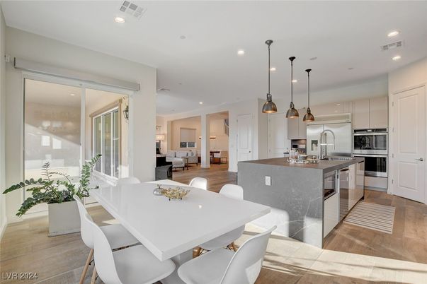 Dining room, Interior, Kitchen, Pendant Lights, Recessed Lighting, Stainless Steel Appliances, Wood Texture Flooring