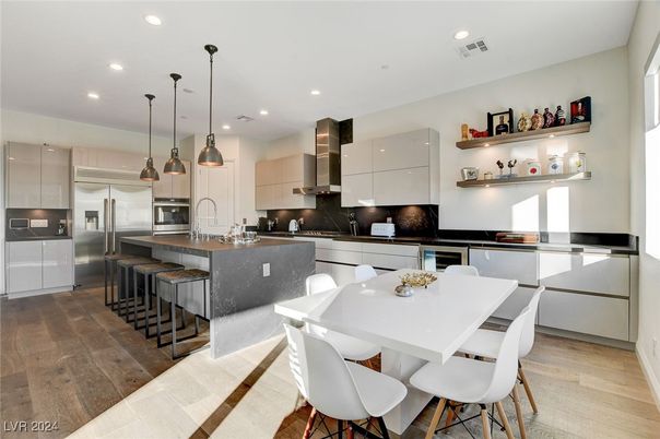 Dining room, Interior, Kitchen, Pendant Lights, Recessed Lighting, Stainless Steel Appliances, Wood Texture Flooring