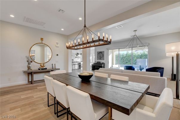 Chandelier, Dining room, Fireplace, Interior, Living room, Pendant Lights, Recessed Lighting, Wood Texture Flooring