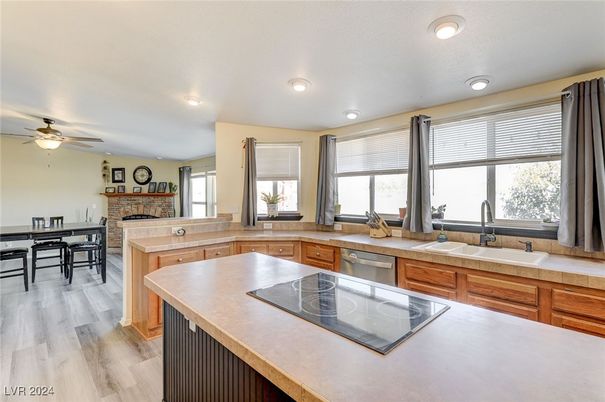 Dining room, Fireplace, Interior, Kitchen, Recessed Lighting, Wood Texture Flooring