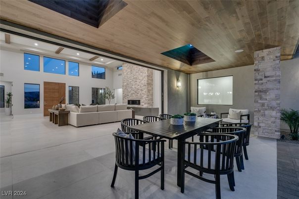 Dining room, Fireplace, Interior, Living room, Recessed Lighting, Stone Walls, Wooden Ceilings