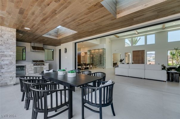 Dining room, Fireplace, Interior, Living room, Recessed Lighting, Stone Walls, Wooden Ceilings