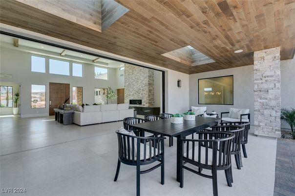 Dining room, Fireplace, Interior, Living room, Recessed Lighting, Stone Walls, Wooden Ceilings