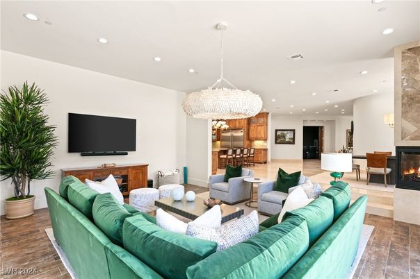 Chandelier, Dining room, Fireplace, Interior, Living room, Pendant Lights, Recessed Lighting, Wood Texture Flooring