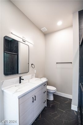 Bathroom, Dual Sink Vanities, Interior, Marble, Marble Walls, Recessed Lighting