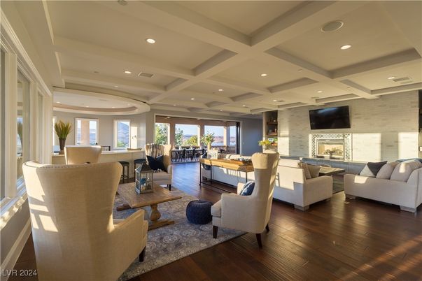 Dining room, Fireplace, Interior, Living room, Recessed Lighting, Stone Walls, Wood Texture Flooring