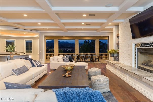 Dining room, Fireplace, Interior, Living room, Recessed Lighting, Stone Walls, Wood Texture Flooring