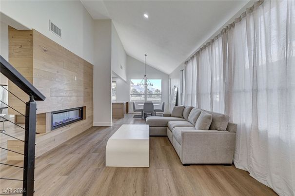 Dining room, Fireplace, Interior, Living room, Pendant Lights, Recessed Lighting, Wood Texture Flooring, Wooden Walls
