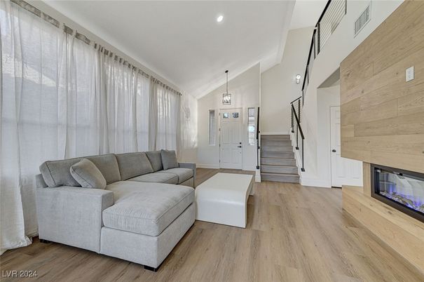 Fireplace, Interior, Pendant Lights, Recessed Lighting, Wood Texture Flooring, Wooden Walls