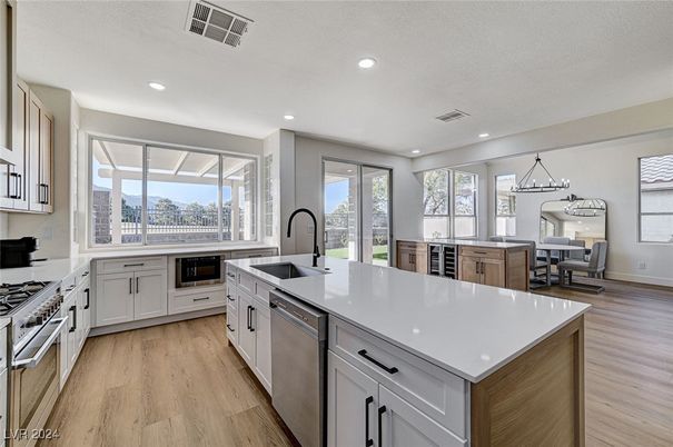 Dining room, Interior, Kitchen, Pendant Lights, Recessed Lighting, Stainless Steel Appliances, Wood Texture Flooring