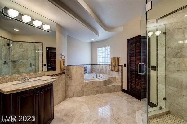 Bathroom, Dual Sink Vanities, Glass Shower, Interior, Marble Walls, Recessed Lighting