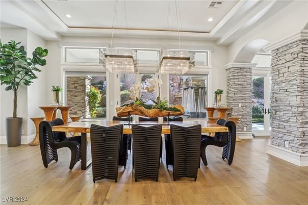 Chandelier, Dining room, Interior, Pendant Lights, Recessed Lighting, Stone Walls, Wood Texture Flooring