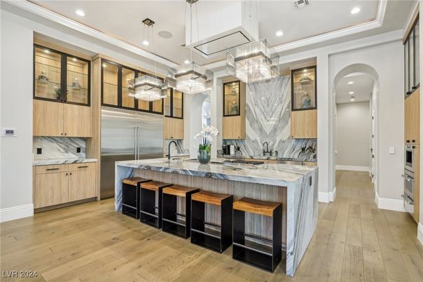 Interior, Kitchen, Marble Walls, Pendant Lights, Recessed Lighting, Stainless Steel Appliances, Wood Texture Flooring