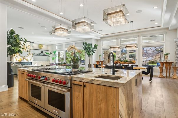 Chandelier, Dining room, Interior, Kitchen, Pendant Lights, Recessed Lighting, Stainless Steel Appliances, Wood Texture Flooring