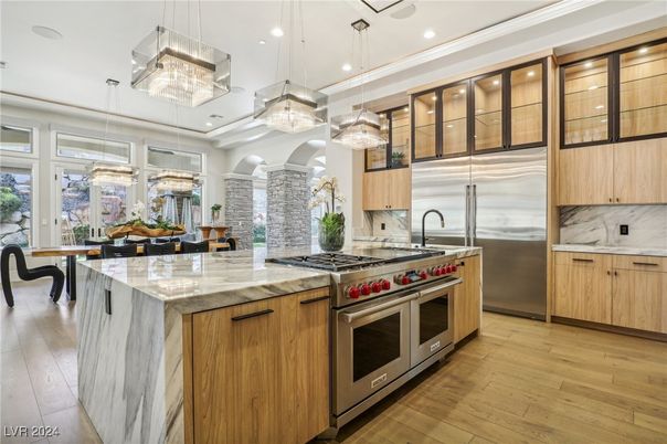 Chandelier, Dining room, Interior, Kitchen, Pendant Lights, Recessed Lighting, Stainless Steel Appliances, Wood Texture Flooring