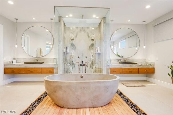 Bathroom, Dual Sink Vanities, Free Standing Baths, Glass Shower, Interior, Marble Walls, Pendant Lights, Recessed Lighting