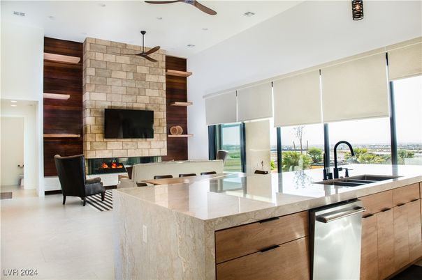 Fireplace, Interior, Kitchen, Living room, Recessed Lighting, Stainless Steel Appliances, Stone Walls