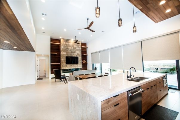 Fireplace, Interior, Kitchen, Pendant Lights, Recessed Lighting, Stainless Steel Appliances, Stone Walls, Wooden Ceilings