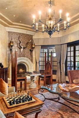 Chandelier, Fireplace, Interior, Living room, Recessed Lighting, Stone Walls, Wood Texture Flooring