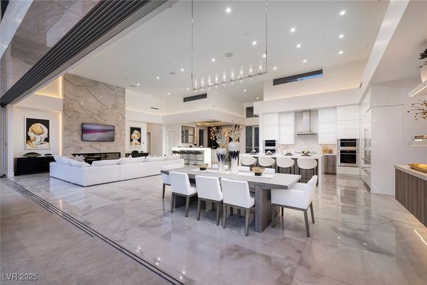 Dining room, Fireplace, Interior, Kitchen, Living room, Marble, Marble Walls, Pendant Lights, Recessed Lighting, Stainless Steel Appliances