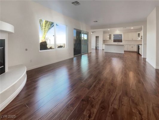 Empty room, Fireplace, Interior, Kitchen, Pendant Lights, Recessed Lighting, Wood Texture Flooring