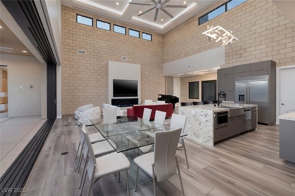 Dining room, Interior, Kitchen, Recessed Lighting, Stainless Steel Appliances, Stone Walls, Wood Texture Flooring