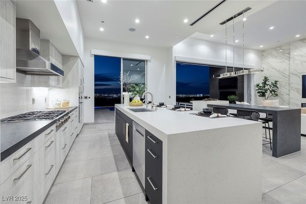 Interior, Kitchen, Marble Walls, Pendant Lights, Recessed Lighting, Stainless Steel Appliances