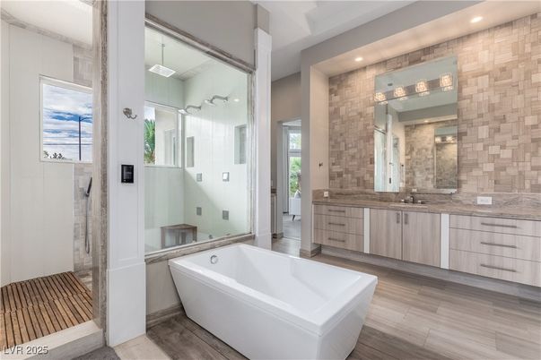 Bathroom, Dual Sink Vanities, Free Standing Baths, Glass Shower, Interior, Recessed Lighting, Wood Texture Flooring
