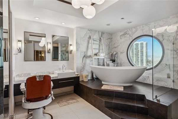 Bathroom, Dual Sink Vanities, Free Standing Baths, Glass Shower, Interior, Marble Walls, Recessed Lighting