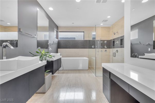 Bathroom, Dual Sink Vanities, Free Standing Baths, Glass Shower, Interior, Recessed Lighting, Wood Texture Flooring