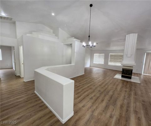 Chandelier, Empty room, Fireplace, Interior, Pendant Lights, Recessed Lighting, Wood Texture Flooring