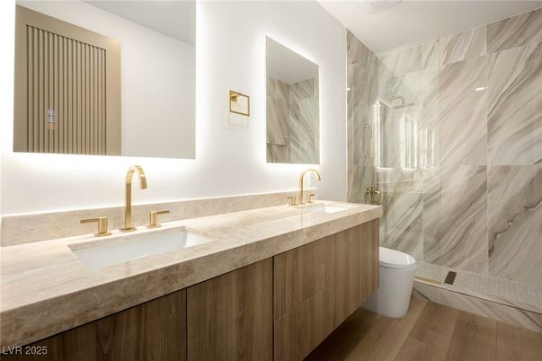 Bathroom, Dual Sink Vanities, Glass Shower, Interior, Marble Walls, Wood Texture Flooring