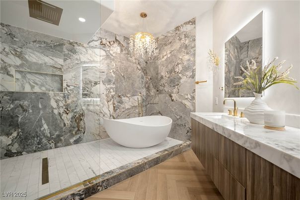 Bathroom, Free Standing Baths, Glass Shower, Interior, Marble Walls, Pendant Lights, Recessed Lighting, Wood Texture Flooring