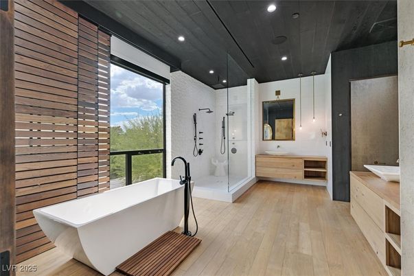 Bathroom, Free Standing Baths, Glass Shower, Interior, Recessed Lighting, Wood Texture Flooring, Wooden Walls