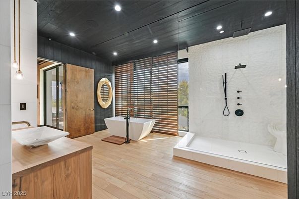 Bathroom, Free Standing Baths, Glass Shower, Interior, Marble Walls, Recessed Lighting, Wood Texture Flooring