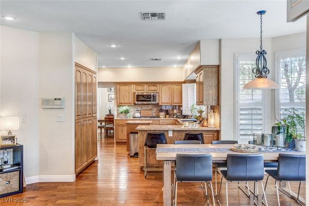 Dining room, Interior, Kitchen, Pendant Lights, Recessed Lighting, Stainless Steel Appliances, Wood Texture Flooring