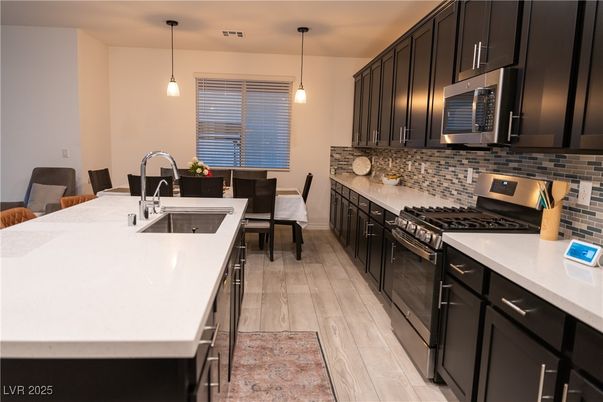 Dining room, Interior, Kitchen, Pendant Lights, Stainless Steel Appliances, Wood Texture Flooring