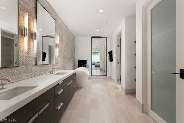 Bathroom, Dual Sink Vanities, Free Standing Baths, Glass Shower, Interior, Recessed Lighting, Wood Texture Flooring