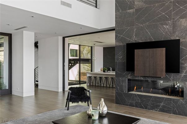 Fireplace, Interior, Marble Walls, Recessed Lighting, Wood Texture Flooring