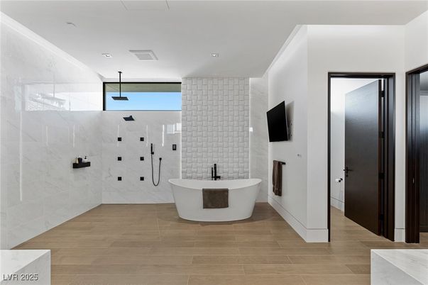 Bathroom, Free Standing Baths, Glass Shower, Interior, Marble Walls, Recessed Lighting, Wood Texture Flooring