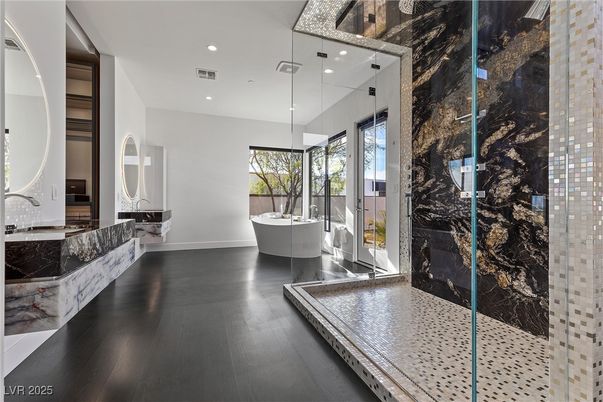 Bathroom, Free Standing Baths, Glass Shower, Interior, Marble Walls, Recessed Lighting, Wood Texture Flooring