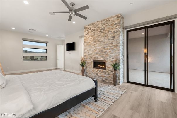 Bedroom, Fireplace, Interior, Recessed Lighting, Stone Walls, Wood Texture Flooring