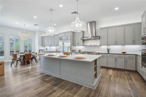 Chandelier, Dining room, Interior, Kitchen, Pendant Lights, Recessed Lighting, Stainless Steel Appliances, Wood Texture Flooring