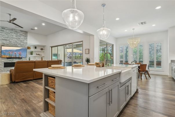 Chandelier, Dining room, Interior, Kitchen, Living room, Pendant Lights, Recessed Lighting, Stone Walls, Wood Texture Flooring
