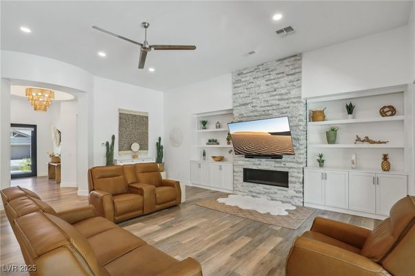 Fireplace, Interior, Living room, Recessed Lighting, Stone Walls, Wood Texture Flooring