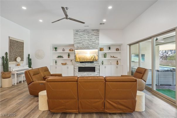 Fireplace, Interior, Living room, Piano, Recessed Lighting, Stone Walls, Wood Texture Flooring