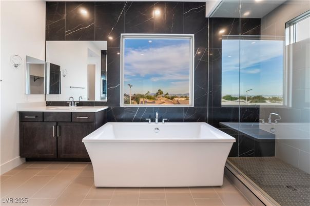 Bathroom, Dual Sink Vanities, Free Standing Baths, Glass Shower, Interior, Marble Walls, Recessed Lighting
